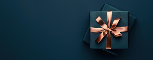 Dark elegant gift with a luxurious bow on a navy background