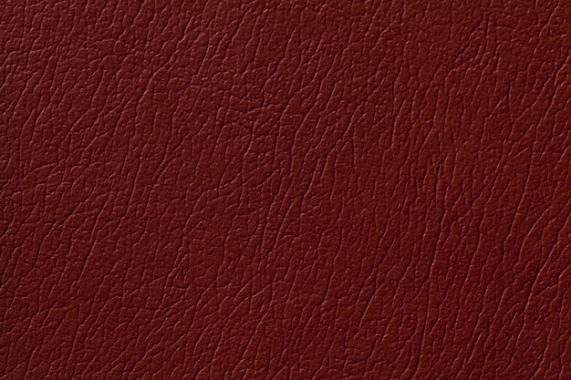 Dark ginger leather texture background with pattern, closeup