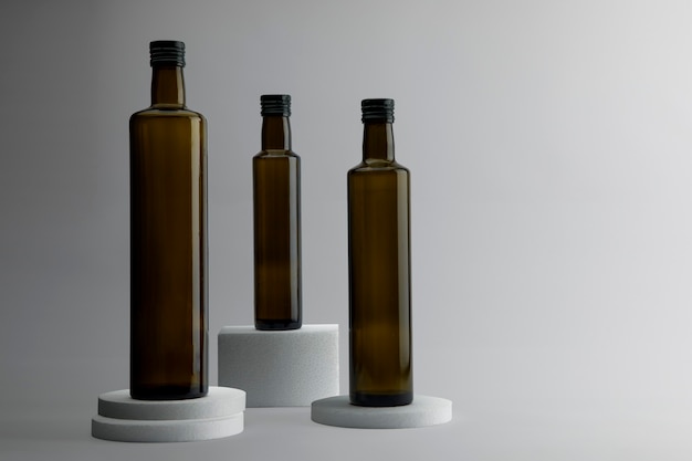 Dark glass bottle on bases and white background