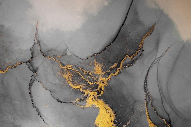 紙に大理石の液体インクアート絵画のダークゴールドの抽象的な背景