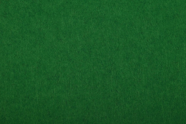 Dark green felt background texture close up