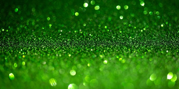 Dark green glitter lights. Shiny sparkles, bokeh effects, glowing surface. Selective focus, christmas abstract banner, background photo