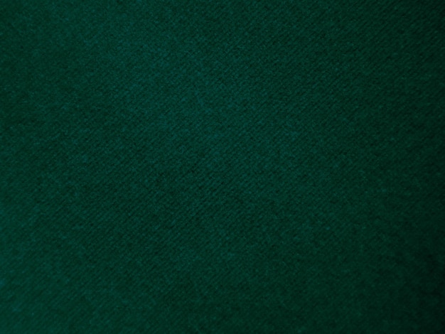 배경으로 사용되는 짙은 녹색 오래 된 벨벳 패브릭 질감 빈 녹색 패브릭 배경