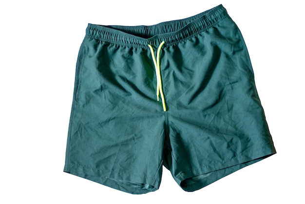 Photo dark green shorts or trunks on a white insulated background