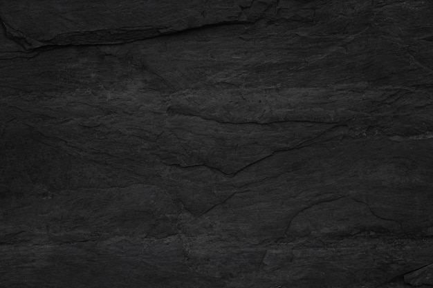 濃い灰色の黒いスレートの背景またはテクスチャ黒御影石のスラブの背景