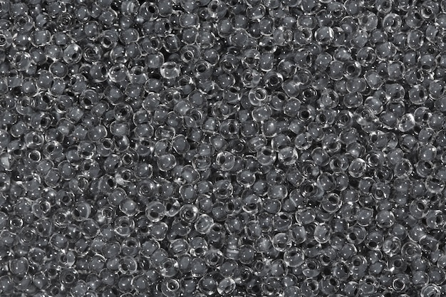 Dark grey glass seed beads background