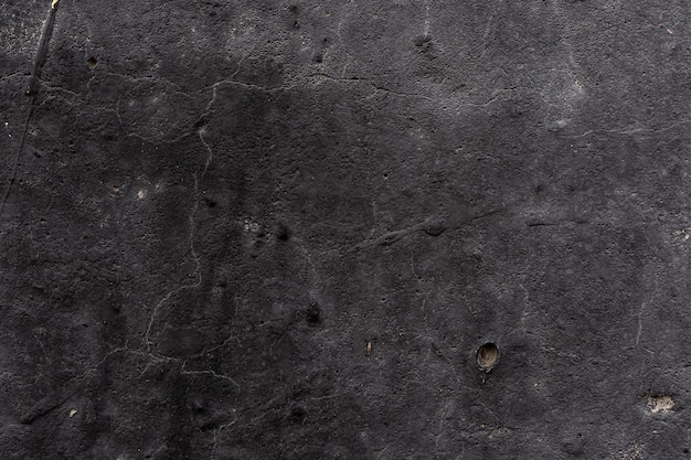 Texture scuro grungy vecchio cemento grezzo nero struttura della parete di cemento