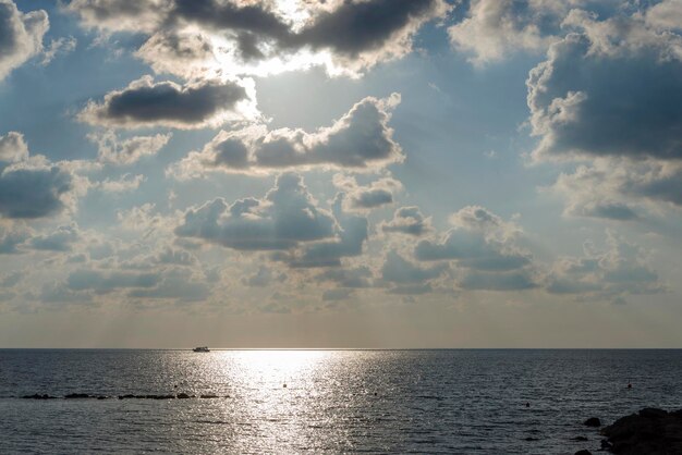 Dark heavy clouds covered the blue sky over Mediterranean sea Hard rain clouds