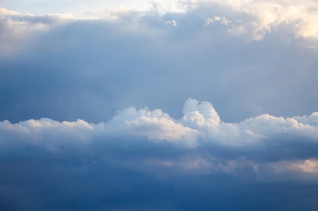 Dark horizontal clouds illuminated by the evening sun_