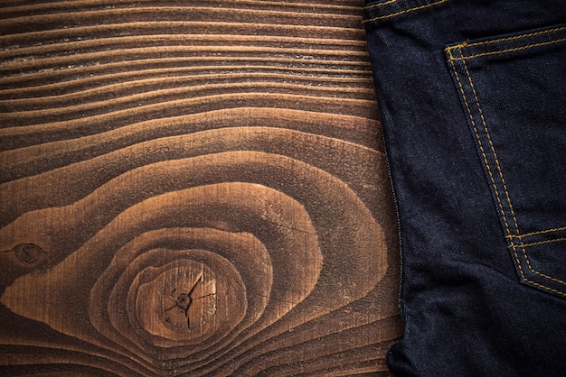 Dark jeans on wooden board