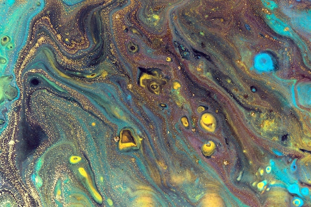 Dark liquid pattern with bright blue and gold cells