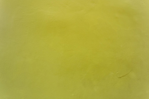 사진 오래된 그루지 벽 콘크리트 질감을 배경으로 하는 짙은 중간 노란색