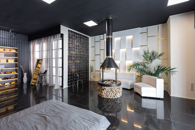 Dark modern stylish male apartment interior with lighting, decorative walls, fireplace, dressing area and huge window