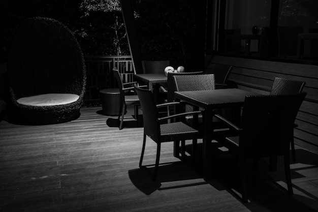 Photo in the dark monochrome of restaurant table in the night