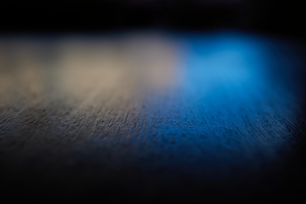 Dark office wooden table bokeh