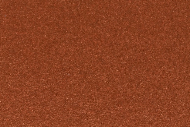 Dark orange paper, highly detailed red grunge background. High resolution photo.