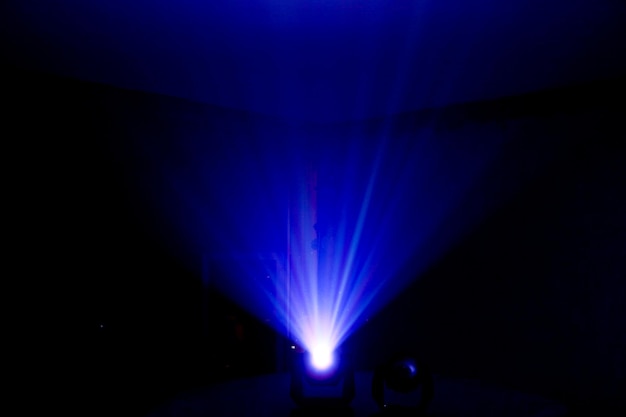 Dark picture of lamp with blue stage light