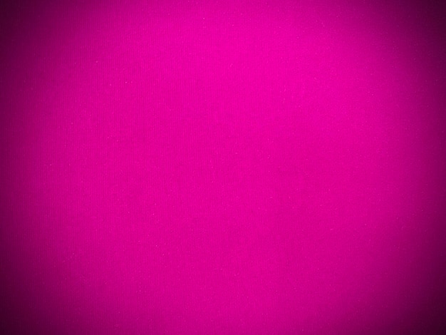 背景として使用される濃いピンク色のベルベット生地のテクスチャ ...
