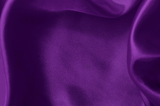 Фото Темно-фиолетовый фон текстуры ткани скомканный узор из шелка или льна