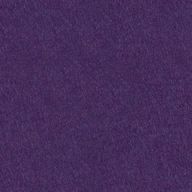 Dark purple felt texture for design Seamless square background tile ready