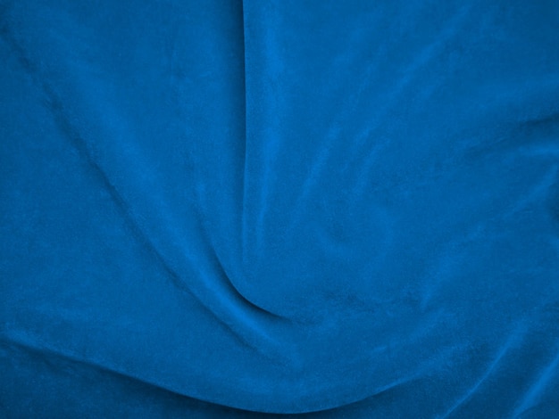 Фото Темно-фиолетовая бархатная текстура ткани, используемая в качестве фона