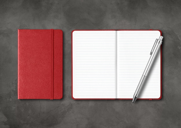 Dark red closed and open lined notebooks with a pen. Mockup isolated on black concrete background