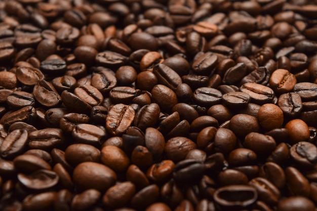 Dark roast coffee beans background top view