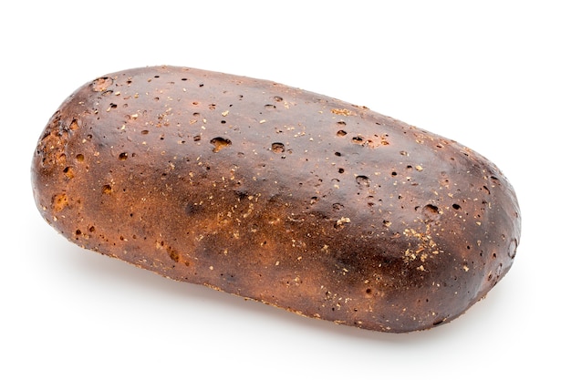 Dark rue bread on a white surface.