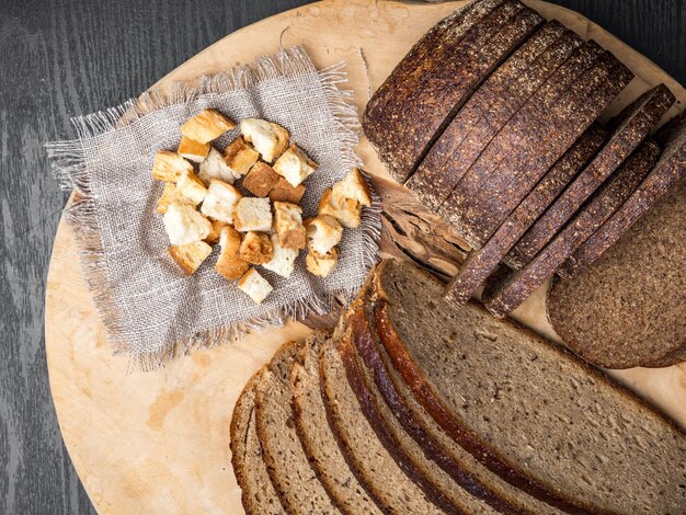 Dark rue bread on a wooden background