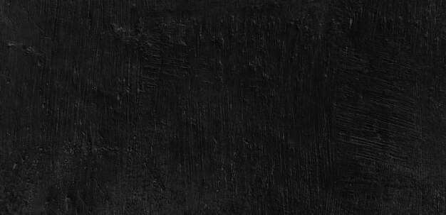 Dark scary black grunge textured concrete stone wall background\
old black wall texture cement