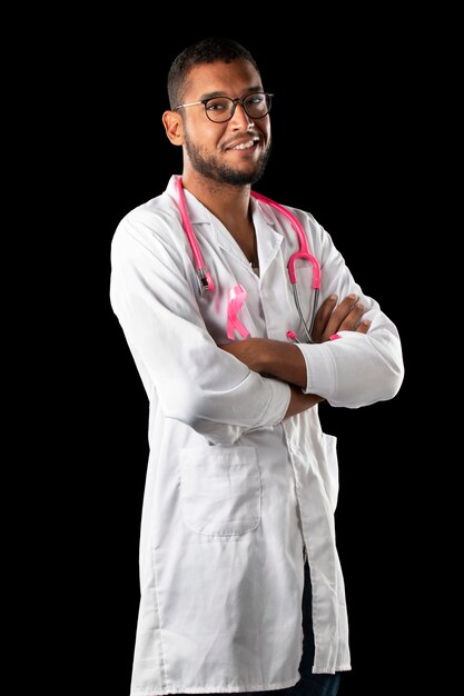 Dark skin doctor with pink stethoscope and pink awareness breast cancer ribbon 