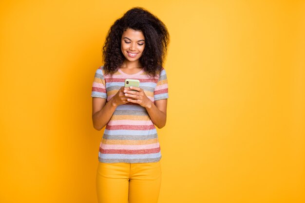   dark skin girl using digital cell phone