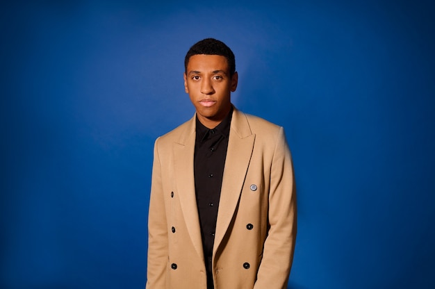 A dark-skinned good-looking young man in a suit