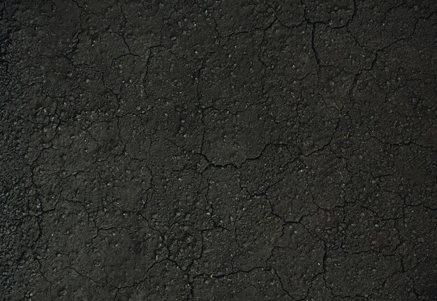 Фото Текстура темной почвы крупным планом на фоне сухой почвы