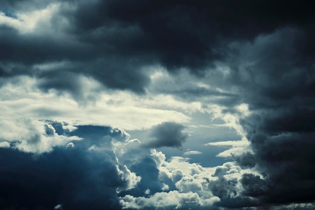 Dark storm clouds with breaking sunlight