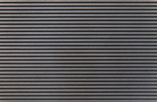 Dark striped wooden wall. Interior element