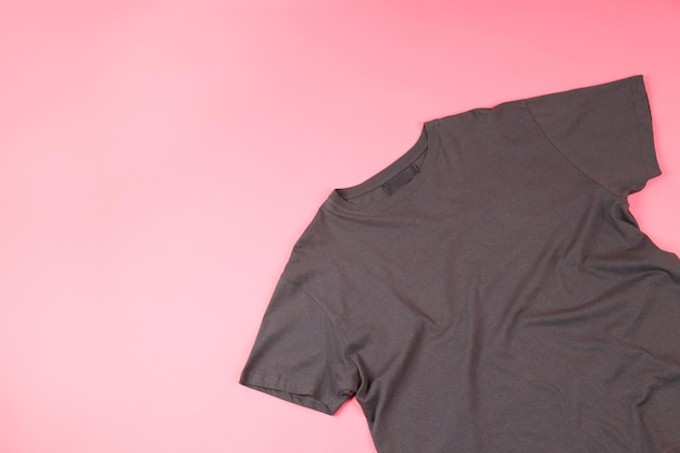 Photo dark t-shirt with space for print on pink background