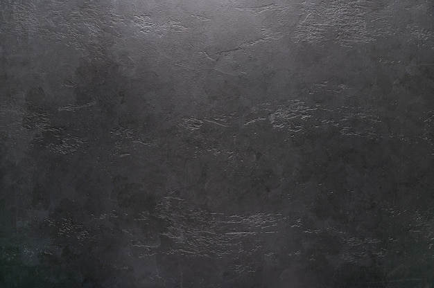 Dark textural graphite background