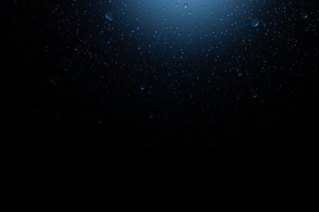 Dark underwater background with water bubbles and sunlight 3d rendering illustration