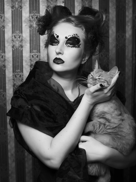 Dark vampire woman with cat