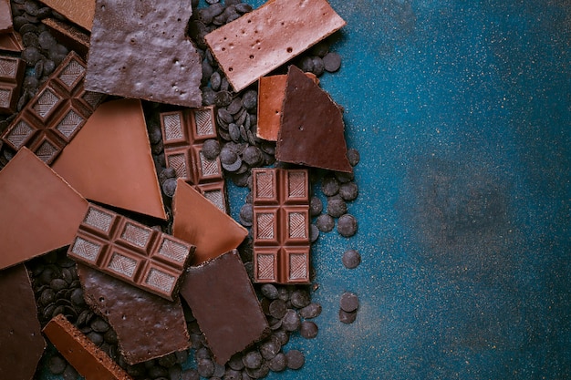 Dark, white and milk chocolate pieces. Top view