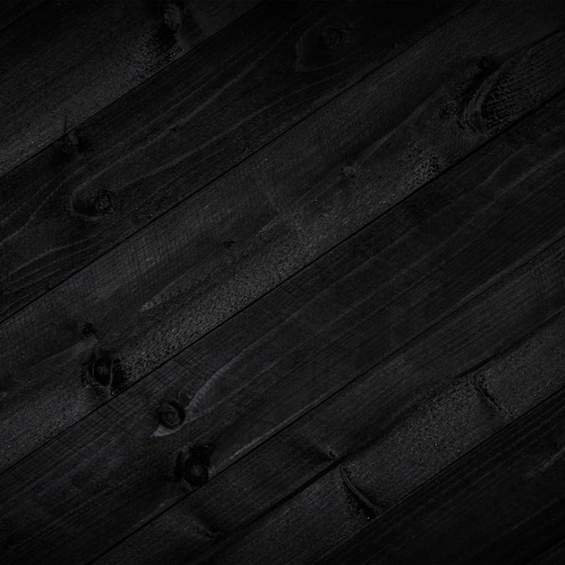 A dark wood background with a dark background and a wooden plank that says'black '