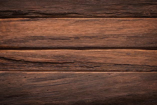 Dark wood grain brown board with a natural pattern wooden background