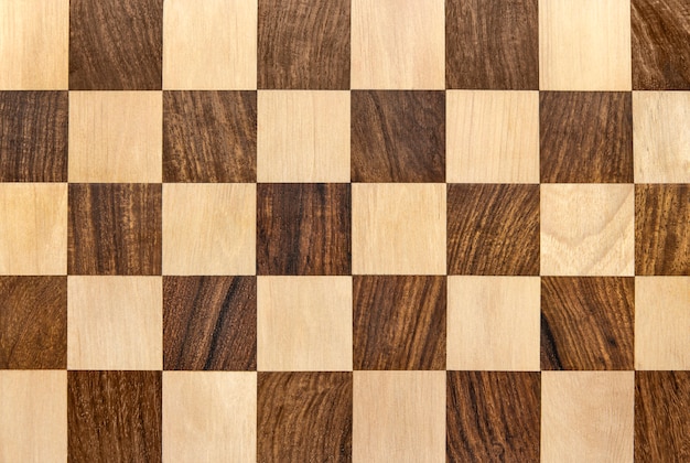 Dark wooden chessboard checkered background