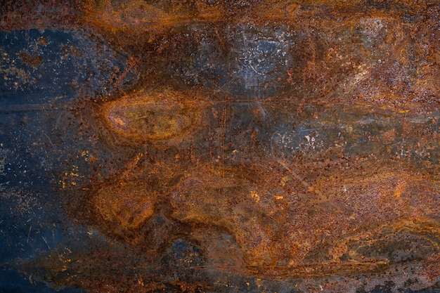 Dark worn rusty metal texture background.