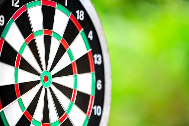 Dartboard closeup with blur bokeh background business target\
dart board sport and business concept