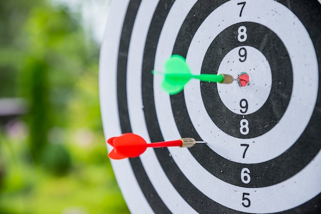 Dartboard with darts.