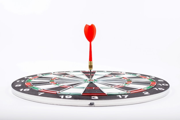 Dartboard with red dart arrow