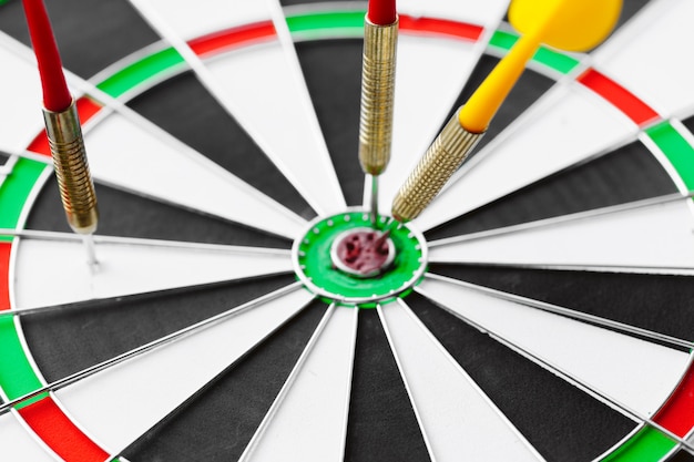 Darts stuck in dartboard