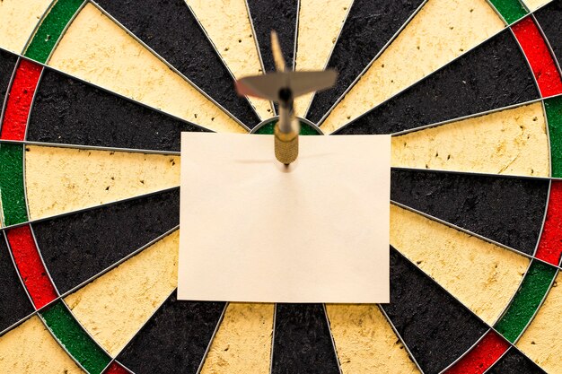 Darts with dart arrow which was pinned a sheet of paper for labels